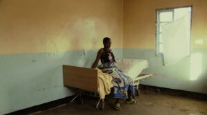 Janet sits in the small Tanzanian clinic waiting for the birth of her child. (everymothercounts.org)