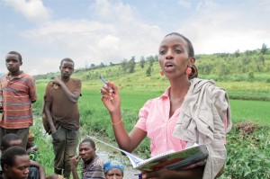 In Rwamagana, Rwanda, Alice Cyanzayire reviews fertilizer needs with local rice farmers.