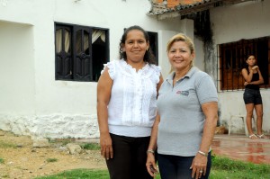 Beduith (left) and her Opportunity Colombia loan officer.