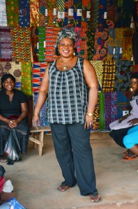 Opportunity client Patience Dameh sells fabric out of one of the most vibrant stalls in the Kasseh Market in Ada, Ghana.