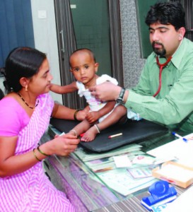When her baby was sick, Deepa Kahar's (left) health insurance through Opportunity covered treatment and medicine.
