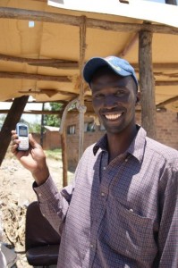 Opportunity Malawi savings client & maize wholesaler Joseph Meke uses the M'ganga service to check his account balance every day by cell phone, makes deposits at Opportunity's Ndirande satellite branch, and uses a point-of-sale (POS) device in nearby Ntcheu to withdraw cash.