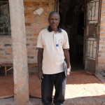 Josephat Nivin, in front of his home in Kinyamakobe, Uganda.