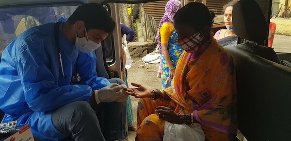 Administering vaccinations to those in remote areas through a mobile van. 