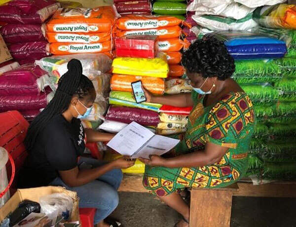 A female mentor, right, meets with her mentee from Sinapi Aba in Ghana