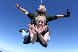 Young professional Sarah jumps out of a plane for Opportunity Tanzania.