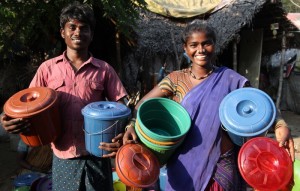 Client Deepa (right) with tiffin boxes, India.