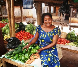 Opportunity client Joyce Williamson sells produce in a market in Mwanga, Tanzania.