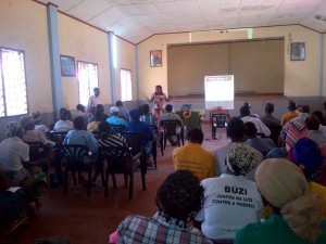 Financial literacy training to a roomful of farmers.