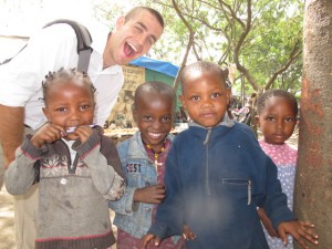 AJ with local kids in Arusha, just outside a client's home.