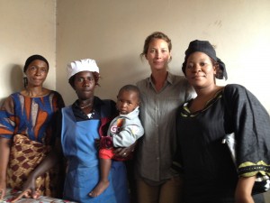 Christy visits client Lydia Mwakalinga’s restaurant with Arusha Branch Manager Esther John Mark (right).