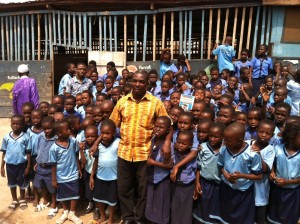George Owusu Asare and students of the King George International School in Ashaiman.