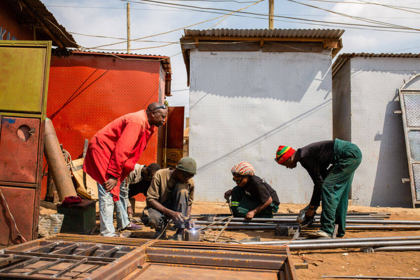 Luhavu’s apprentices train in welding at his shop.
