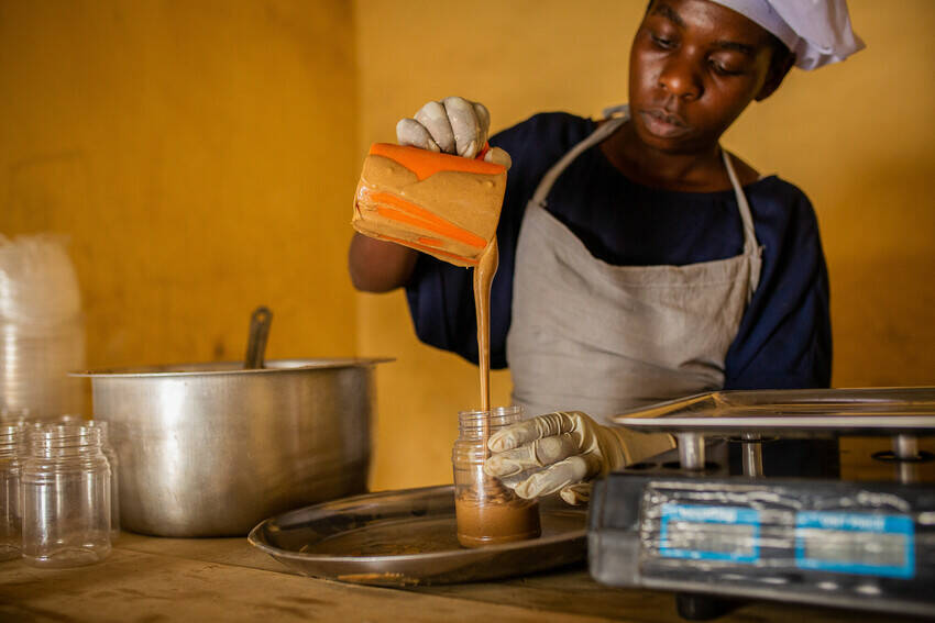 Savino is a young refugee and entrepreneur living in the Nakivale refugee settlement in Uganda. With training, support, and access to financial resources, he started a peanut butter business that now employs three other people.