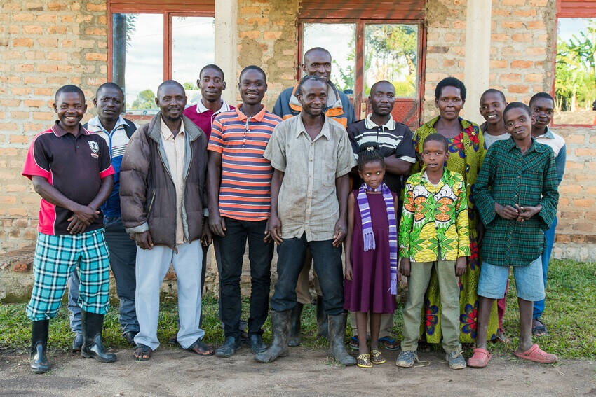 Elijah (back row, center), a successful Farmer Support Agent, and his group of young farmers that he trains and supports.